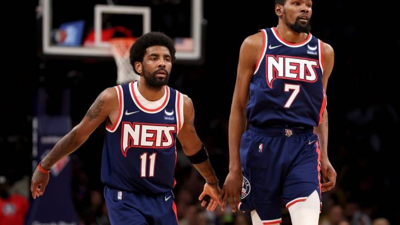 Apr 25, 2022; Brooklyn, New York, USA; Brooklyn Nets guard Kyrie Irving (11) and forward Kevin Durant (7) drop back on defense during the second quarter of game four of the first round of the 2022 NBA playoffs against the Boston Celtics at Barclays Center. Mandatory Credit: Brad Penner-USA TODAY Sports