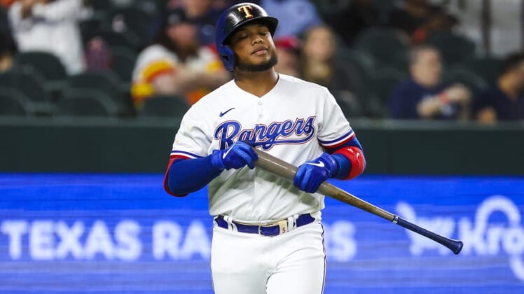 Apr 26, 2022; Arlington, Texas, USA;  Texas Rangers designated hitter Willie Calhoun (4) reacts after striking out during the seventh inning against the Houston Astros at Globe Life Field. Mandatory Credit: Kevin Jairaj-USA TODAY Sports