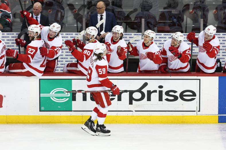 Apr 29, 2022; Newark, New Jersey, USA; Detroit Red Wings left wing Tyler Bertuzzi (59) celebrates his goal with teammates during the third period against the New Jersey Devils at Prudential Center. Mandatory Credit: Vincent Carchietta-USA TODAY Sports