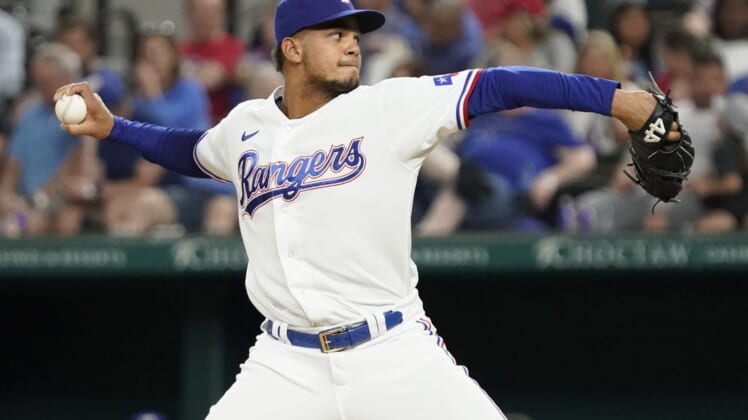 Apr 29, 2022; Arlington, Texas, USA; Texas Rangers relief pitcher Albert Abreu (36) throws to the plate during the sixth inning against the Atlanta Braves at Globe Life Field. Mandatory Credit: Raymond Carlin III-USA TODAY Sports