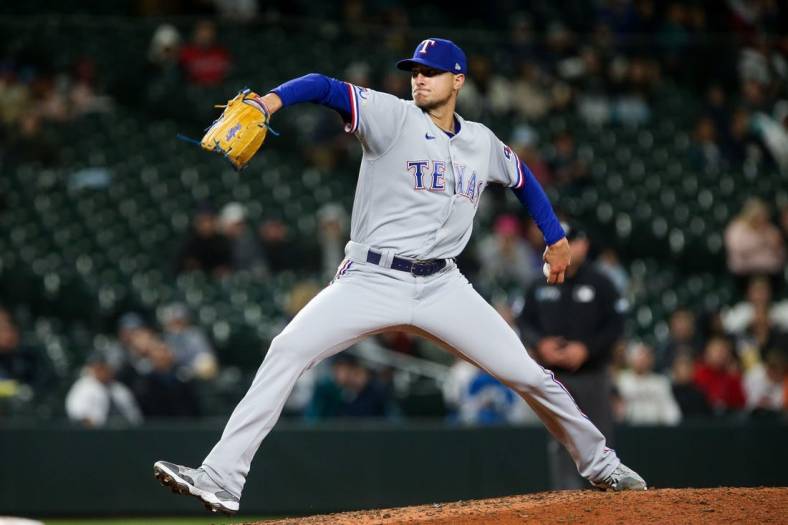 Apr 21, 2022; Seattle, Washington, USA;  Texas Rangers relief pitcher Brett Martin (59) delivers during the sixth inning against the Seattle Mariners at T-Mobile Park. Mandatory Credit: Lindsey Wasson-USA TODAY Sports