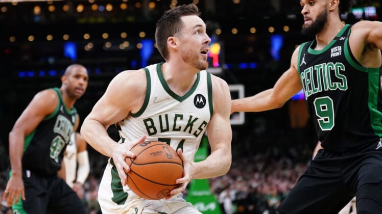 May 1, 2022; Boston, Massachusetts, USA; Milwaukee Bucks guard Pat Connaughton (24) drives the ball against Boston Celtics guard Derrick White (9) in the second half during game one of the second round for the 2022 NBA playoffs at TD Garden. Mandatory Credit: David Butler II-USA TODAY Sports