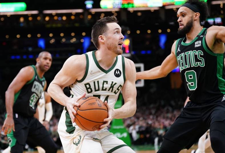 May 1, 2022; Boston, Massachusetts, USA; Milwaukee Bucks guard Pat Connaughton (24) drives the ball against Boston Celtics guard Derrick White (9) in the second half during game one of the second round for the 2022 NBA playoffs at TD Garden. Mandatory Credit: David Butler II-USA TODAY Sports