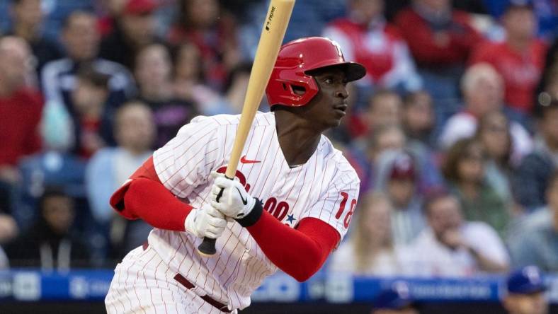 May 3, 2022; Philadelphia, Pennsylvania, USA; Philadelphia Phillies shortstop Didi Gregorius (18) hits an RBI single during the first inning against the Texas Rangers at Citizens Bank Park. Mandatory Credit: Bill Streicher-USA TODAY Sports