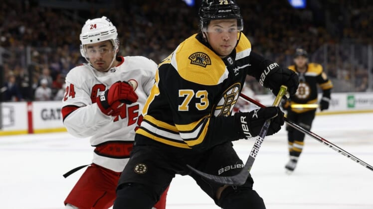May 6, 2022; Boston, Massachusetts, USA; Boston Bruins defenseman Charlie McAvoy (73) gets position on Carolina Hurricanes center Seth Jarvis (24) during the third period in game three of the first round of the 2022 Stanley Cup Playoffs at TD Garden. Mandatory Credit: Winslow Townson-USA TODAY Sports