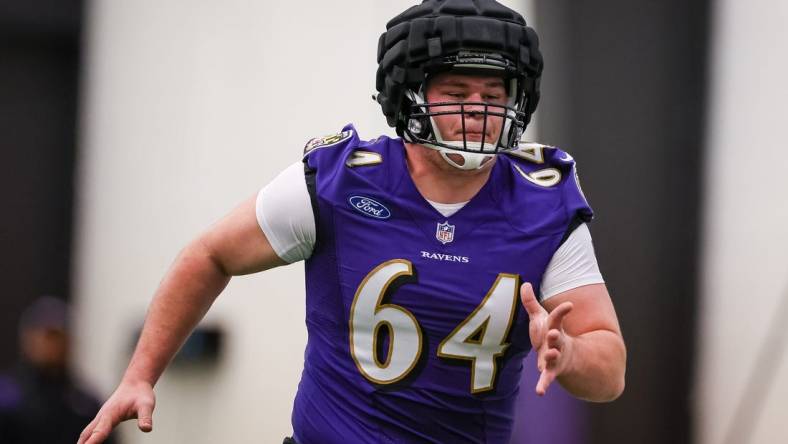 May 7, 2022; Owings Mills, MD, USA; Baltimore Ravens center Tyler Linderbaum (64) in action during rookie minicamp at Under Armour Performance Center. Mandatory Credit: Scott Taetsch-USA TODAY Sports