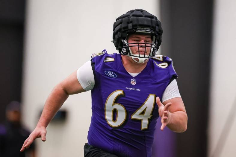 May 7, 2022; Owings Mills, MD, USA; Baltimore Ravens center Tyler Linderbaum (64) in action during rookie minicamp at Under Armour Performance Center. Mandatory Credit: Scott Taetsch-USA TODAY Sports
