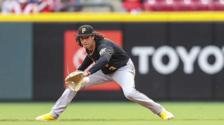 May 7, 2022; Cincinnati, Ohio, USA; Pittsburgh Pirates shortstop Cole Tucker (3) grounds the ball against the Cincinnati Reds in the eighth inning at Great American Ball Park. Mandatory Credit: Katie Stratman-USA TODAY Sports