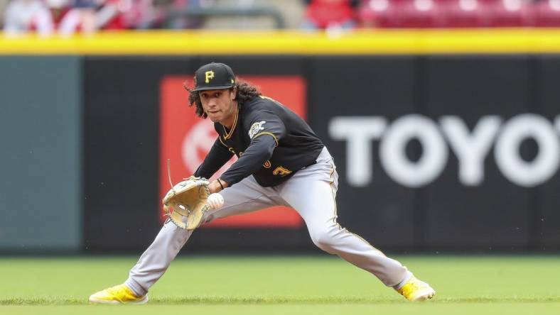 May 7, 2022; Cincinnati, Ohio, USA; Pittsburgh Pirates shortstop Cole Tucker (3) grounds the ball against the Cincinnati Reds in the eighth inning at Great American Ball Park. Mandatory Credit: Katie Stratman-USA TODAY Sports