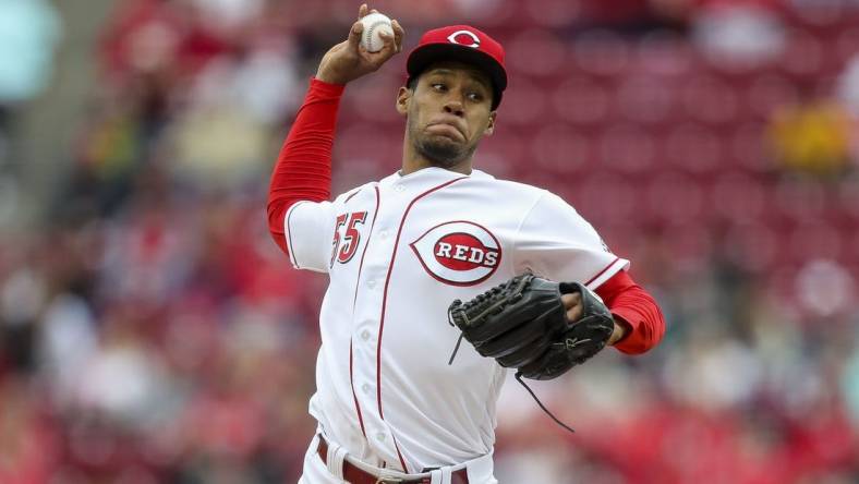 May 7, 2022; Cincinnati, Ohio, USA; Cincinnati Reds pitcher Dauri Moreta (55) throws against the Pittsburgh Pirates in the first inning at Great American Ball Park. Mandatory Credit: Katie Stratman-USA TODAY Sports