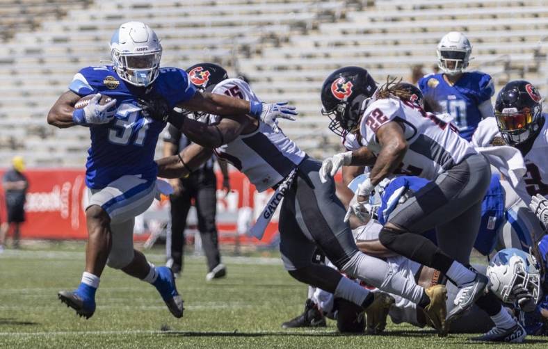 May 8, 2022; Birmingham, AL, USA; New Orleans Breakers running back Jordan Ellis (31) runs for a touchdown against the Houston Gamblers during the first half at Protective Stadium. Mandatory Credit: Vasha Hunt-USA TODAY Sports