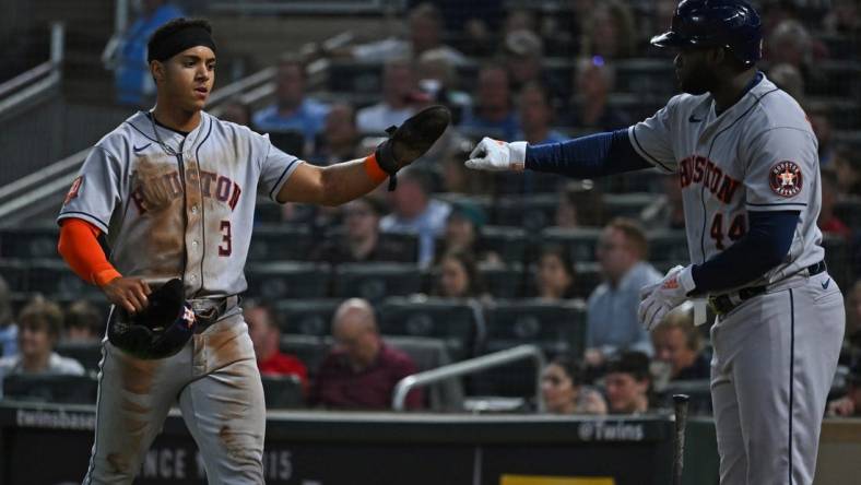 May 10, 2022; Minneapolis, Minnesota, USA;  Houston Astros shortstop Jeremy Pena (3) is congratulated for scoring a run by designated hitter Yordan Alvarez (44) against the Minnesota Twins during the sixth inning at Target Field. Mandatory Credit: Nick Wosika-USA TODAY Sports