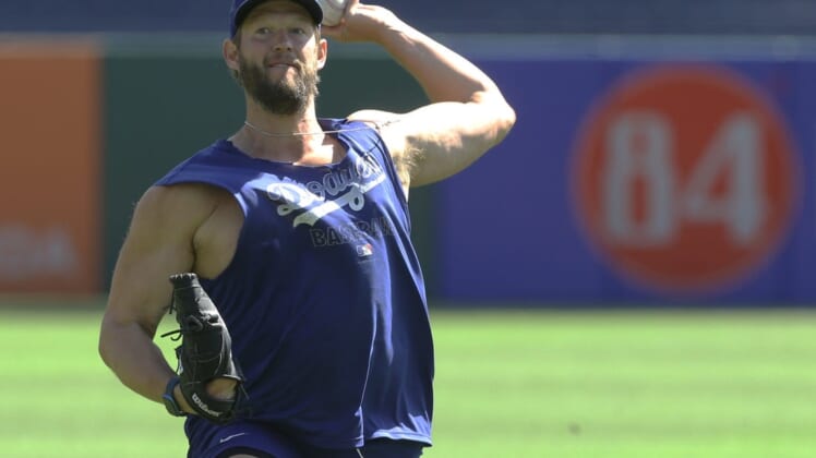 May 11, 2022; Pittsburgh, Pennsylvania, USA;  Los Angeles Dodgers pitcher Clayton Kershaw (22) warms up in the outfield before the game against the Pittsburgh Pirates at PNC Park. Mandatory Credit: Charles LeClaire-USA TODAY Sports