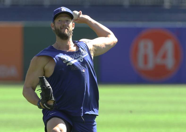 May 11, 2022; Pittsburgh, Pennsylvania, USA;  Los Angeles Dodgers pitcher Clayton Kershaw (22) warms up in the outfield before the game against the Pittsburgh Pirates at PNC Park. Mandatory Credit: Charles LeClaire-USA TODAY Sports