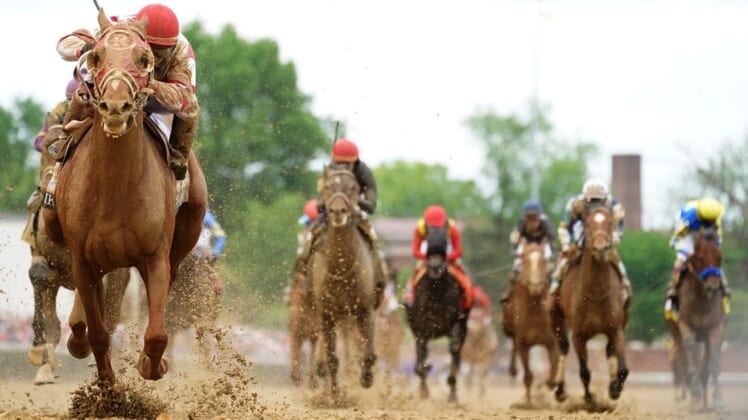 Rich Strike, left, with jockey Sonny Leon aboard, wins the Kentucky Derby.Syndication The Courier Journal
