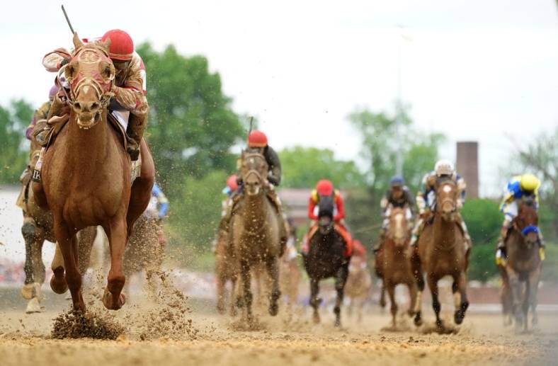 Rich Strike, left, with jockey Sonny Leon aboard, wins the Kentucky Derby.

 Syndication The Courier Journal