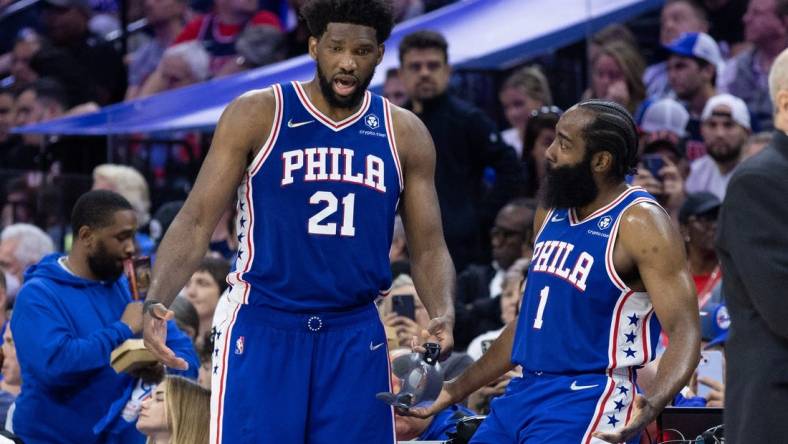 May 12, 2022; Philadelphia, Pennsylvania, USA; Philadelphia 76ers center Joel Embiid (21) and guard James Harden (1) talk during the fourth quarter against the Miami Heat in game six of the second round of the 2022 NBA playoffs at Wells Fargo Center. Mandatory Credit: Bill Streicher-USA TODAY Sports