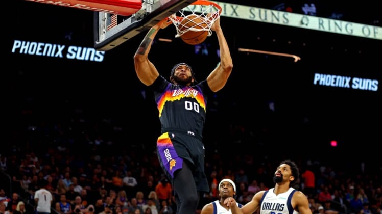 May 15, 2022; Phoenix, Arizona, USA; Phoenix Suns center JaVale McGee (00) dunks the ball against Dallas Mavericks guard Spencer Dinwiddie (26) during the fourth quarter in game seven of the second round for the 2022 NBA playoffs at Footprint Center. Mandatory Credit: Mark J. Rebilas-USA TODAY Sports