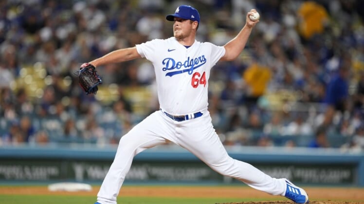May 16, 2022; Los Angeles, California, USA; Los Angeles Dodgers relief pitcher Caleb Ferguson (64) delivers a pitch in the seventh inning against the Arizona Diamondbacks at Dodger Stadium. Mandatory Credit: Kirby Lee-USA TODAY Sports