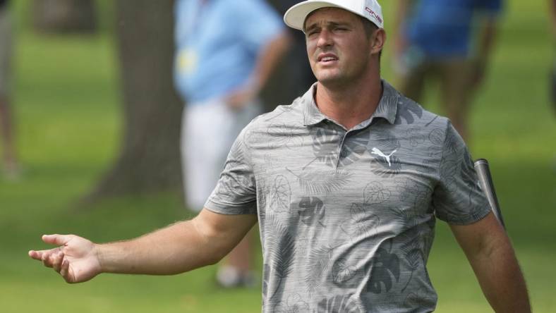 May 17, 2022; Tulsa, Oklahoma, USA; Bryson DeChambeau reacts to his hits from the fairway on the 9th hole during a practice round for the PGA Championship golf tournament at Southern Hills Country Club. Mandatory Credit: Michael Madrid-USA TODAY Sports