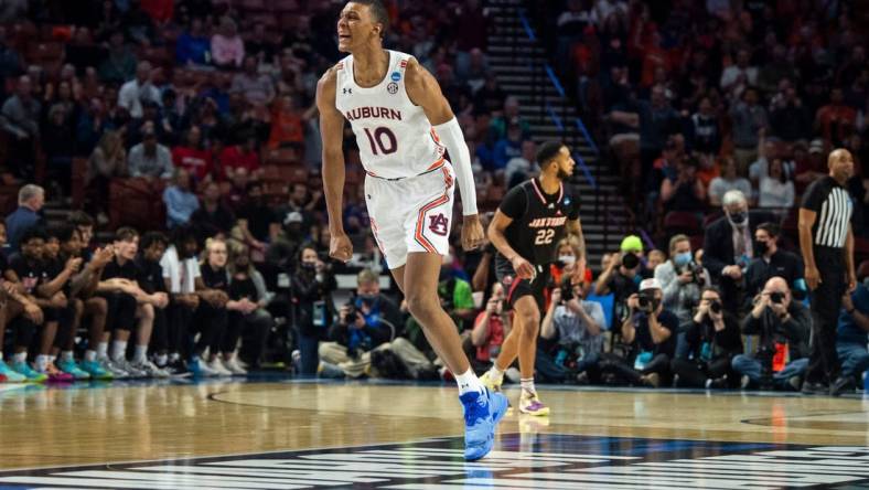 Auburn Tigers forward Jabari Smith (10) celebrates after making a three point basket during the first round of the 2022 NCAA tournament at Bon Secours Wellness Arena in Greenville, S.C., on Friday, March 18, 2022. Auburn Tigers lead Jacksonville State Gamecocks 39-27 at halftime.