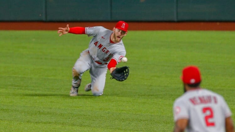 May 18, 2022; Arlington, Texas, USA; Los Angeles Angels right fielder Taylor Ward (3) makes a diving catch during the eighth inning against the Texas Rangers at Globe Life Field. Mandatory Credit: Andrew Dieb-USA TODAY Sports