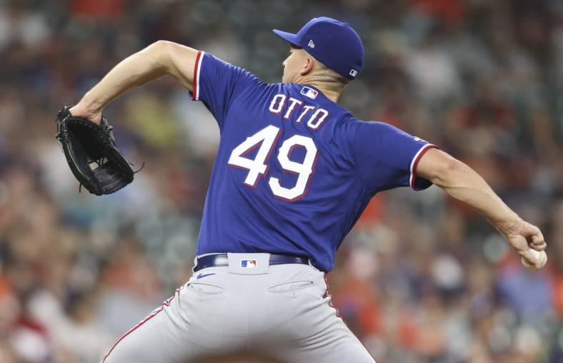 May 19, 2022; Houston, Texas, USA; Texas Rangers starting pitcher Glenn Otto (49) pitches against the Houston Astros in the first inning at Minute Maid Park. Mandatory Credit: Thomas Shea-USA TODAY Sports