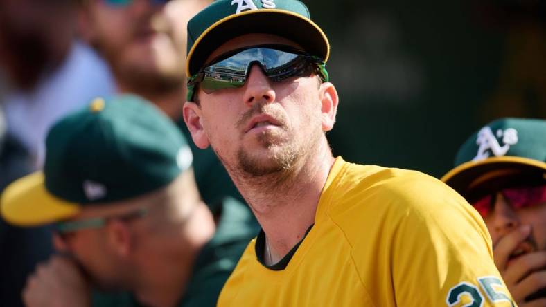 May 15, 2022; Oakland, California, USA; Oakland Athletics right fielder Stephen Piscotty (25) watches play from the dugout against the Los Angeles Angels during the ninth inning at RingCentral Coliseum. Mandatory Credit: Robert Edwards-USA TODAY Sports