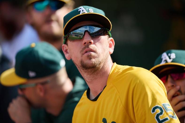 May 15, 2022; Oakland, California, USA; Oakland Athletics right fielder Stephen Piscotty (25) watches play from the dugout against the Los Angeles Angels during the ninth inning at RingCentral Coliseum. Mandatory Credit: Robert Edwards-USA TODAY Sports