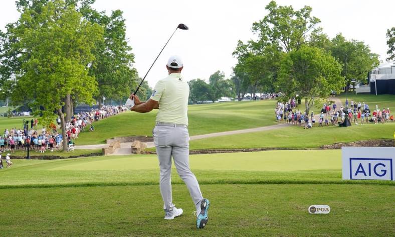 May 20, 2022; Tulsa, OK, USA;  Dustin Johnson plays his shot from the 13th tee during the second round of the PGA Championship golf tournament at Southern Hills Country Club. Mandatory Credit: Michael Madrid-USA TODAY Sports