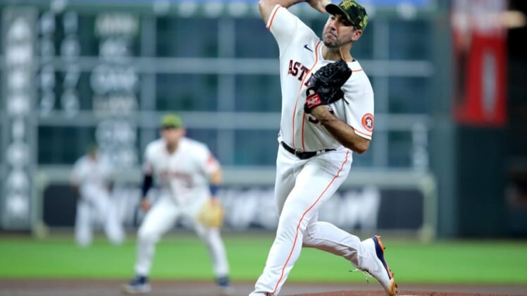 May 21, 2022; Houston, Texas, USA; Houston Astros starting pitcher Justin Verlander (35) delivers a pitch against the Texas Rangers during the first inning at Minute Maid Park. Mandatory Credit: Erik Williams-USA TODAY Sports