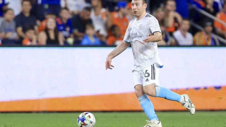 May 21, 2022; Cincinnati, Ohio, USA;  New England Revolution midfielder Thomas McNamara (26) controls the ball against FC Cincinnati in the second half at TQL Stadium. Mandatory Credit: Aaron Doster-USA TODAY Sports