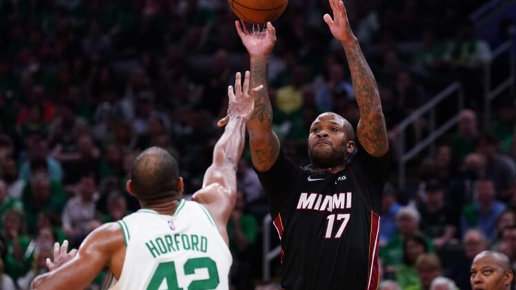 May 21, 2022; Boston, Massachusetts, USA; Miami Heat forward P.J. Tucker (17) shoots the ball against Boston Celtics center Al Horford (42) in the second quarter during game three of the 2022 eastern conference finals at TD Garden. Mandatory Credit: David Butler II-USA TODAY Sports