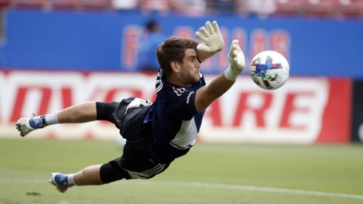 May 22, 2022; Frisco, Texas, USA; FC Dallas goalkeeper Maarten Paes (30) makes a save during warmups before the match against the Minnesota United at Toyota Stadium. Mandatory Credit: Tim Heitman-USA TODAY Sports