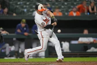 May 22, 2022; Baltimore, Maryland, USA; Baltimore Orioles left fielder Austin Hays (21) hits an RBI single during the ninth inning against the Tampa Bay Rays at Oriole Park at Camden Yards. Mandatory Credit: Gregory Fisher-USA TODAY Sports
