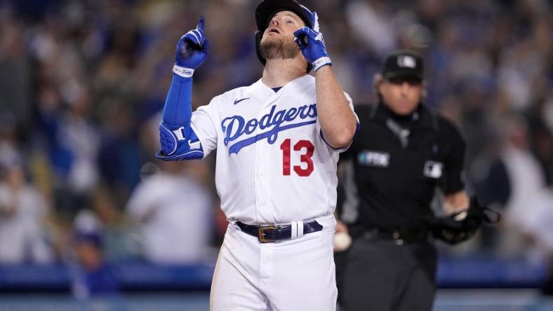 May 4, 2022; Los Angeles, California, USA; Los Angeles Dodgers third baseman Max Muncy (13) celebrates after hitting a two-run home run in the eighth inning against the San Francisco Giants at Dodger Stadium. Mandatory Credit: Kirby Lee-USA TODAY Sports