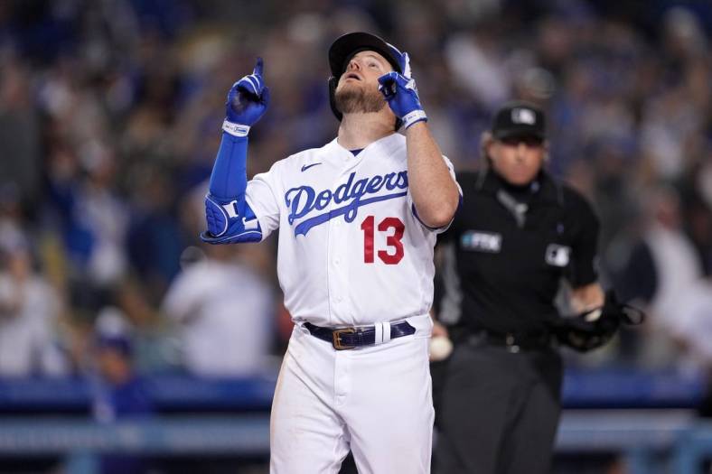 May 4, 2022; Los Angeles, California, USA; Los Angeles Dodgers third baseman Max Muncy (13) celebrates after hitting a two-run home run in the eighth inning against the San Francisco Giants at Dodger Stadium. Mandatory Credit: Kirby Lee-USA TODAY Sports
