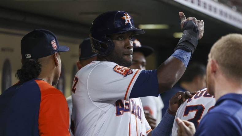 May 24, 2022; Houston, Texas, USA; Houston Astros left fielder Yordan Alvarez (44) celebrates in the dugout after scoring during the fifth inning against the Cleveland Guardians at Minute Maid Park. Mandatory Credit: Troy Taormina-USA TODAY Sports