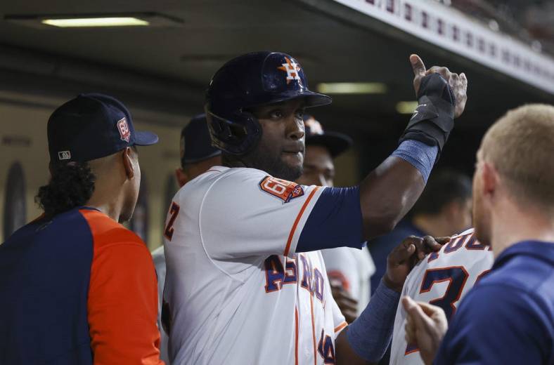 May 24, 2022; Houston, Texas, USA; Houston Astros left fielder Yordan Alvarez (44) celebrates in the dugout after scoring during the fifth inning against the Cleveland Guardians at Minute Maid Park. Mandatory Credit: Troy Taormina-USA TODAY Sports