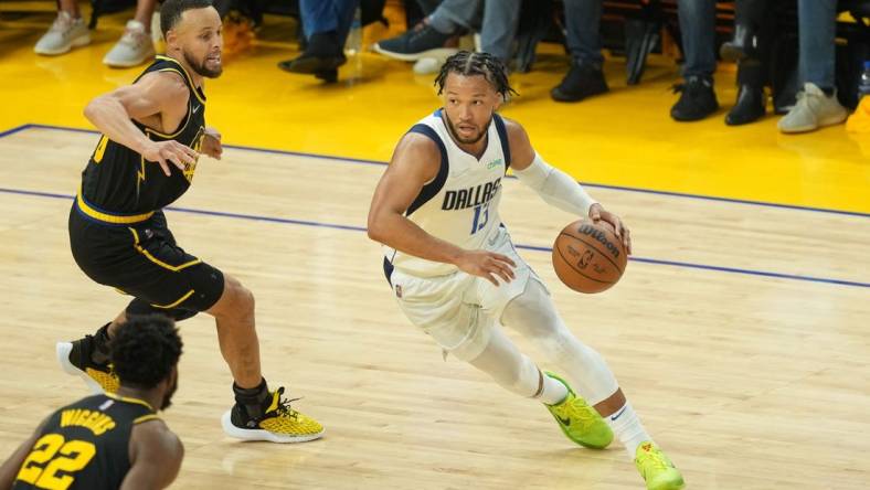 May 18, 2022; San Francisco, California, USA; Dallas Mavericks guard Jalen Brunson (13) dribbles against Golden State Warriors guard Stephen Curry (30) during the second quarter of game one of the 2022 western conference finals at Chase Center. Mandatory Credit: Darren Yamashita-USA TODAY Sports