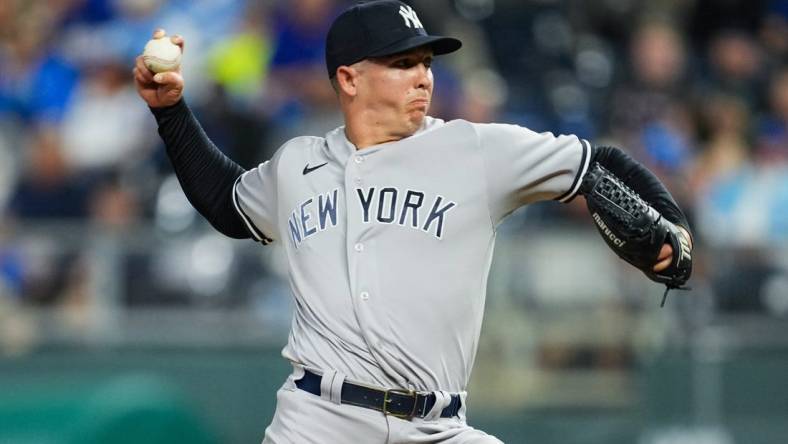 Apr 29, 2022; Kansas City, Missouri, USA; New York Yankees relief pitcher Chad Green (57) pitches against the Kansas City Royals during the seventh inning at Kauffman Stadium. Mandatory Credit: Jay Biggerstaff-USA TODAY Sports