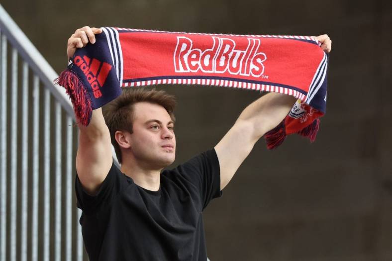May 18, 2022; Harrison, New Jersey, USA; A fan holds a Red Bulls scarf before the game between the New York Red Bulls and the Chicago Fire at Red Bull Arena. Mandatory Credit: Vincent Carchietta-USA TODAY Sports