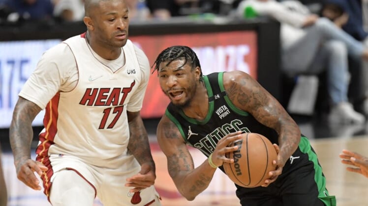 May 25, 2022; Miami, Florida, USA; Boston Celtics guard Marcus Smart (36) drives to the basket against Miami Heat forward P.J. Tucker (17) during the second half of game five of the 2022 eastern conference finals at FTX Arena. Mandatory Credit: Jim Rassol-USA TODAY Sports