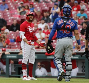 May 26, 2022; Cincinnati, Ohio, USA; Cincinnati Reds first baseman Joey Votto (19) has words with Chicago Cubs catcher Willson Contreras (40) during the seventh inning at Great American Ball Park. Mandatory Credit: David Kohl-USA TODAY Sports