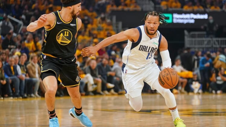 May 26, 2022; San Francisco, California, USA; Dallas Mavericks guard Jalen Brunson (13) dribbles the ball against Golden State Warriors guard Klay Thompson (11) during the first half during game five of the 2022 western conference finals at Chase Center. Mandatory Credit: Cary Edmondson-USA TODAY Sports