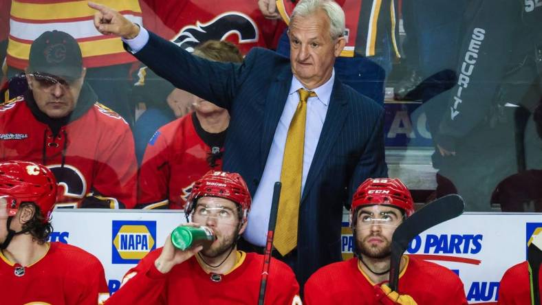 May 26, 2022; Calgary, Alberta, CAN; Calgary Flames head coach Darryl Sutter on his bench against the Edmonton Oilers during the third period in game five of the second round of the 2022 Stanley Cup Playoffs at Scotiabank Saddledome. Mandatory Credit: Sergei Belski-USA TODAY Sports