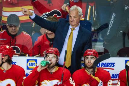 May 26, 2022; Calgary, Alberta, CAN; Calgary Flames head coach Darryl Sutter on his bench against the Edmonton Oilers during the third period in game five of the second round of the 2022 Stanley Cup Playoffs at Scotiabank Saddledome. Mandatory Credit: Sergei Belski-USA TODAY Sports