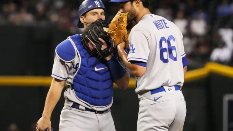 May 26, 2022; Phoenix, Arizona, USA; Los Angeles Dodgers catcher Will Smith (16) talks to starting pitcher Mitch White (66) against the Arizona Diamondbacks in the third inning at Chase Field.Mlb Los Angeles Dodgers At Arizona Diamondbacks