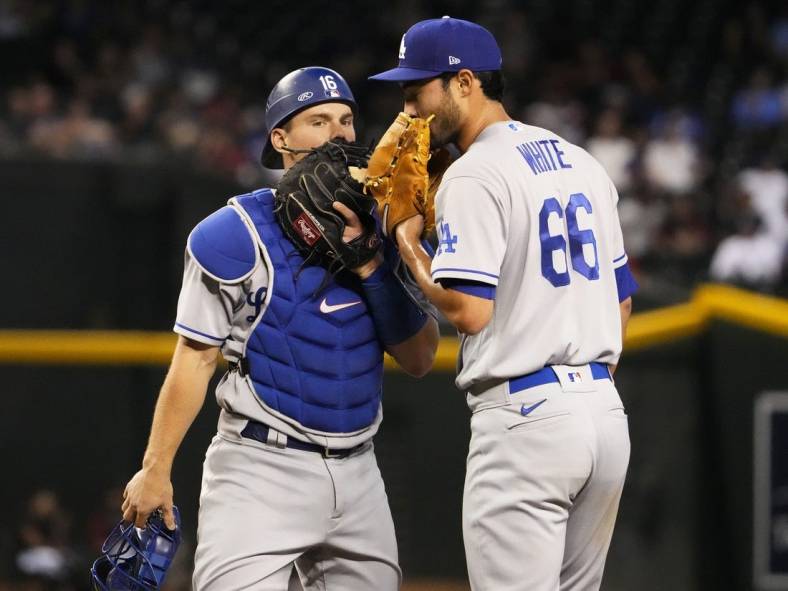 May 26, 2022; Phoenix, Arizona, USA; Los Angeles Dodgers catcher Will Smith (16) talks to starting pitcher Mitch White (66) against the Arizona Diamondbacks in the third inning at Chase Field.

Mlb Los Angeles Dodgers At Arizona Diamondbacks