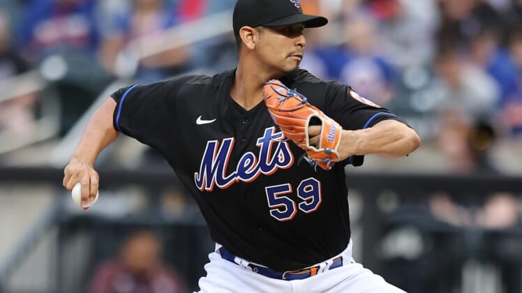 May 27, 2022; New York City, New York, USA; New York Mets starting pitcher Carlos Carrasco (59) delivers a pitch during the first inning against the Philadelphia Phillies at Citi Field. Mandatory Credit: Vincent Carchietta-USA TODAY Sports